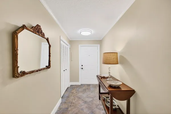 a kitchen with stainless steel appliances kitchen island a refrigerator sink and stove
