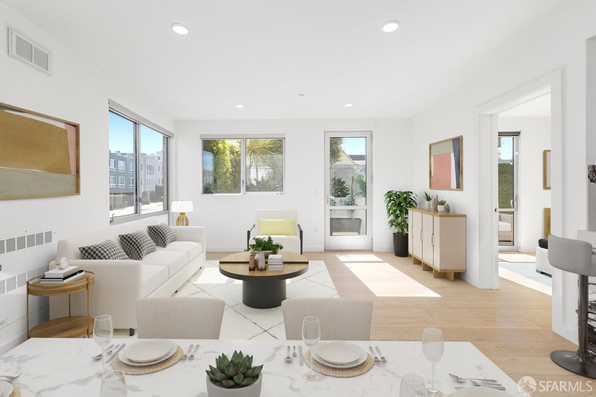 a living room with furniture and a potted plant