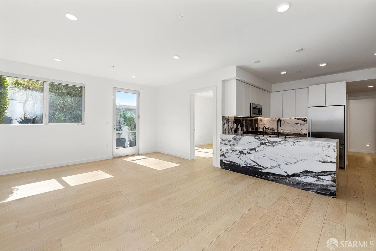 1 Stanyan Street, Unit 24 San Francisco, CA 94118 - Photo 11 of 51 a large bedroom with a bed and a large window