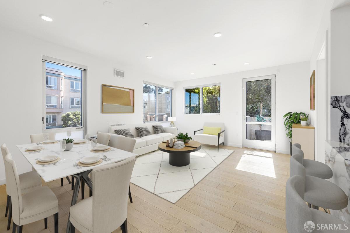 1 Stanyan Street, Unit 24 San Francisco, CA 94118 - Photo 2 of 51 a living room with fireplace furniture and floor to ceiling windows