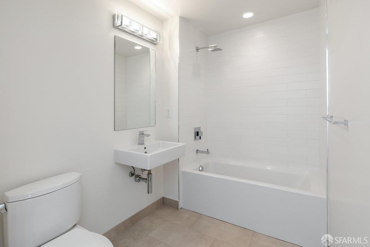 1 Stanyan Street, Unit 24 San Francisco, CA 94118 - Photo 27 of 51 a bathroom with a sink a toilet and shower