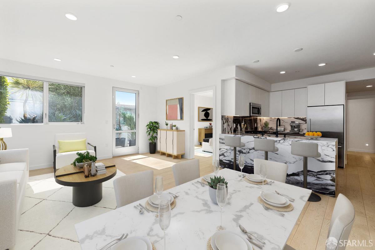 1 Stanyan Street, Unit 24 San Francisco, CA 94118 - Photo 3 of 51 a kitchen with stainless steel appliances kitchen island granite countertop a sink a stove a dining table and chairs