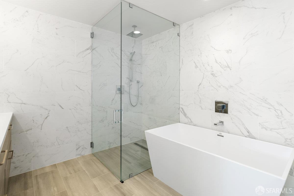 1 Stanyan Street, Unit 24 San Francisco, CA 94118 - Photo 35 of 51 a bathroom with a bathtub and shower