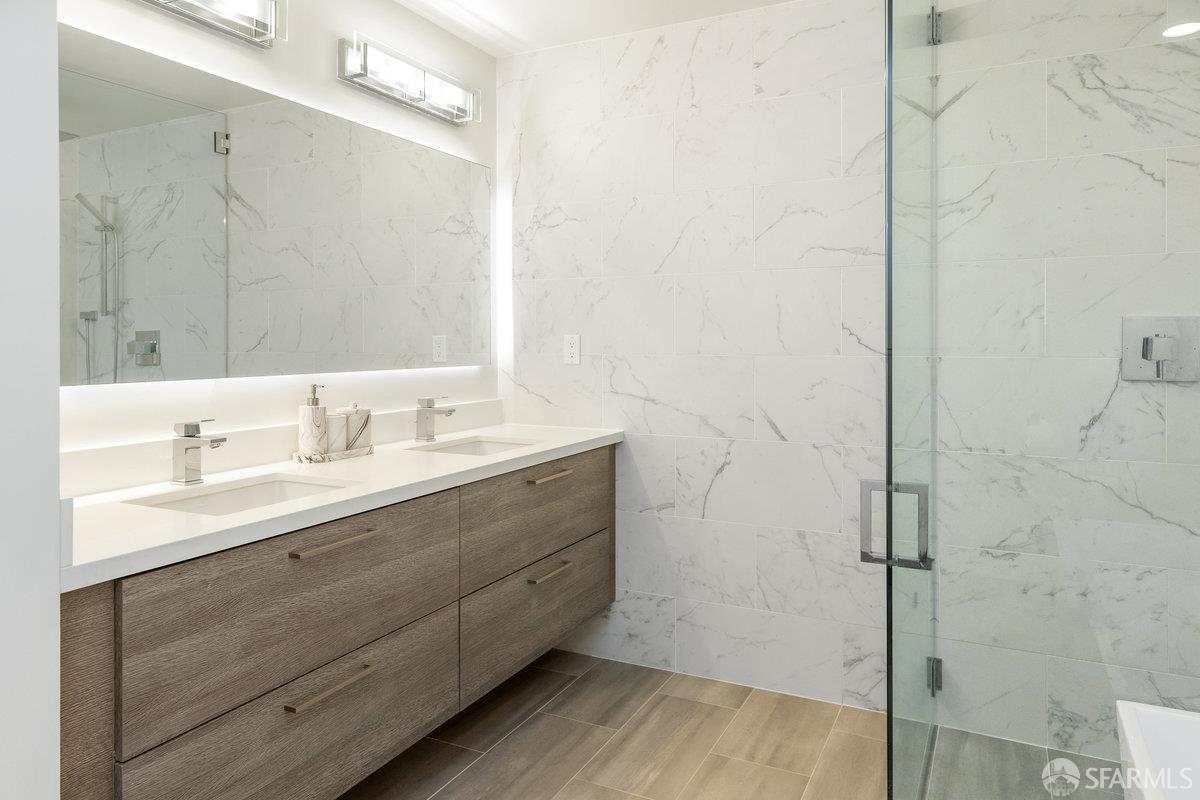 1 Stanyan Street, Unit 24 San Francisco, CA 94118 - Photo 37 of 51 a bathroom with a sink and a mirror
