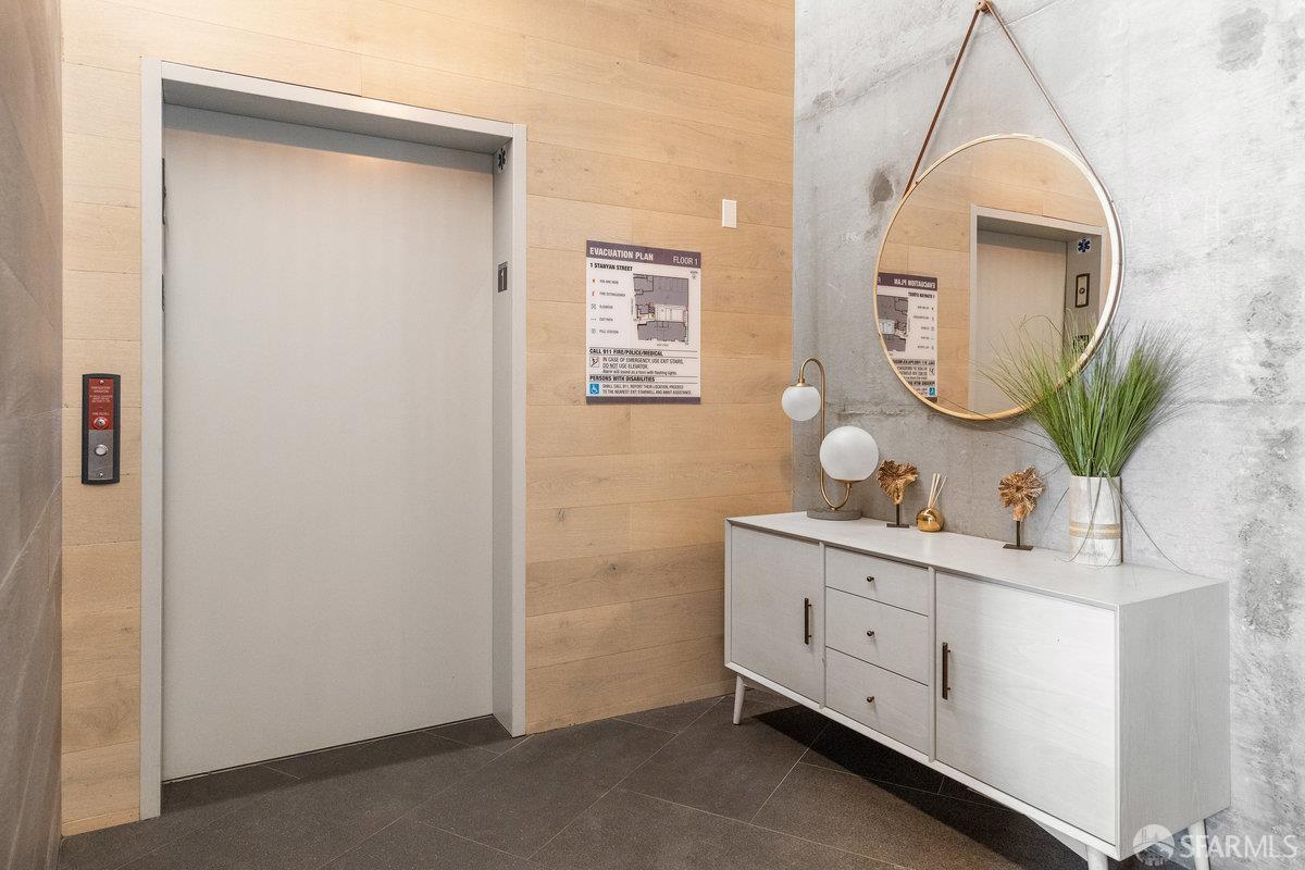 1 Stanyan Street, Unit 24 San Francisco, CA 94118 - Photo 47 of 51 a bathroom with a sink mirror and vanity