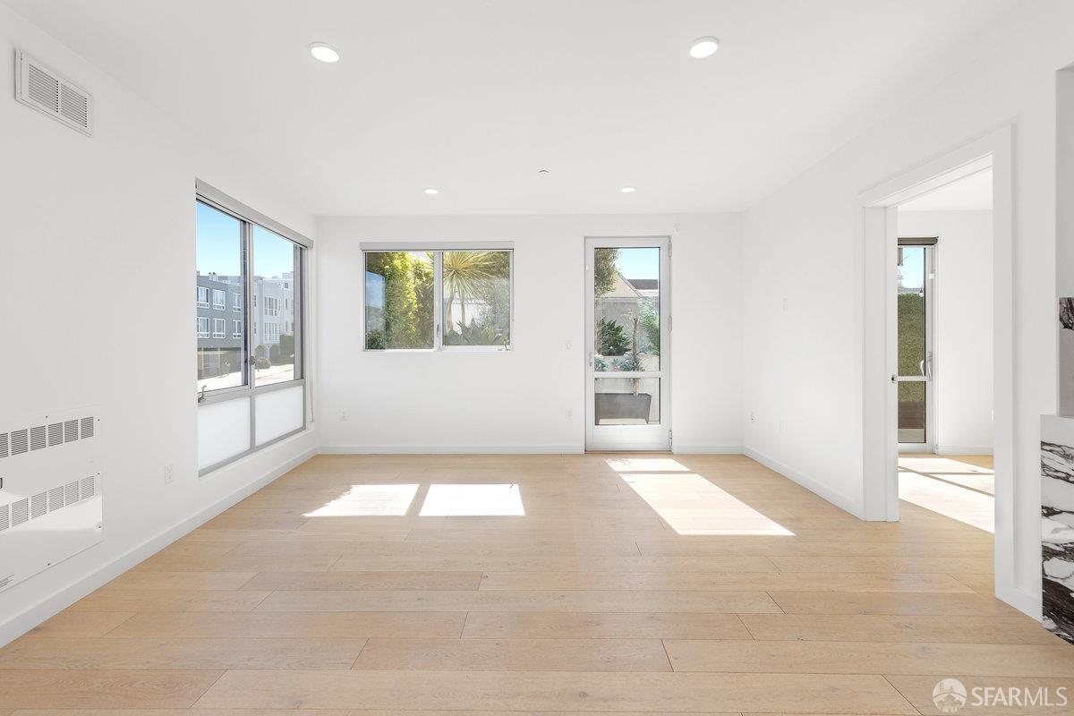 1 Stanyan Street, Unit 24 San Francisco, CA 94118 - Photo 10 of 51 an empty room with windows and entrance