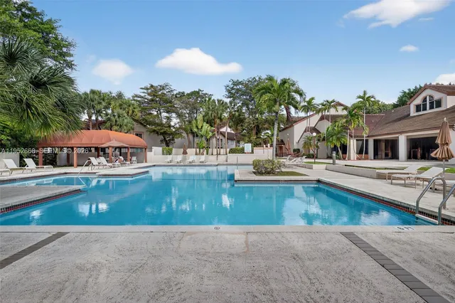 a view of a house with swimming pool