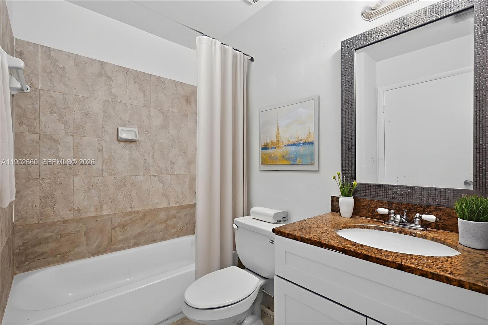 13856 Southwest 93rd Lane, Unit 13856 Miami, FL 33186 - Photo 22 of 37 a bathroom with a granite countertop sink toilet and shower