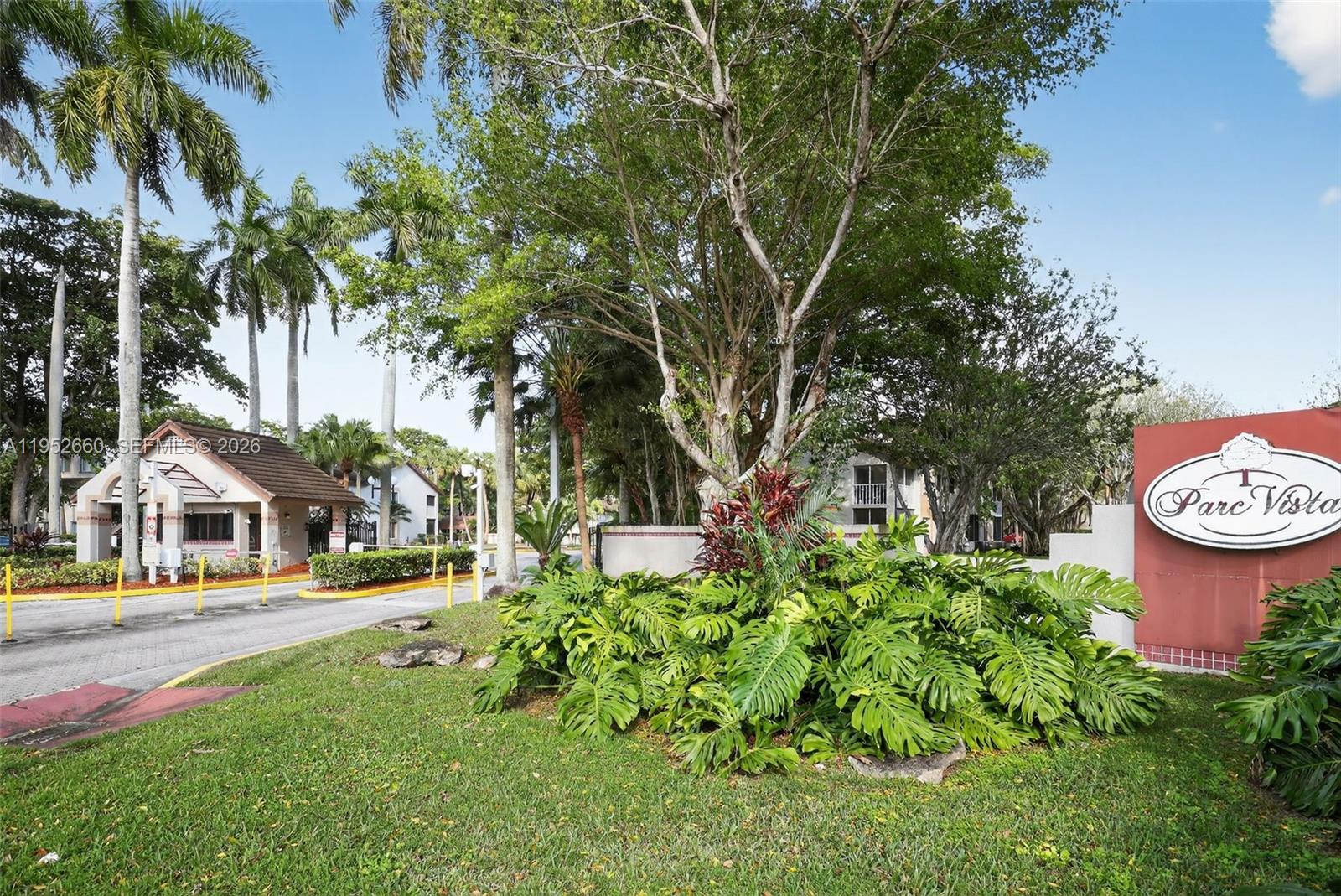 13856 Southwest 93rd Lane, Unit 13856 Miami, FL 33186 - Photo 32 of 37 a front view of a house with a yard and fountain