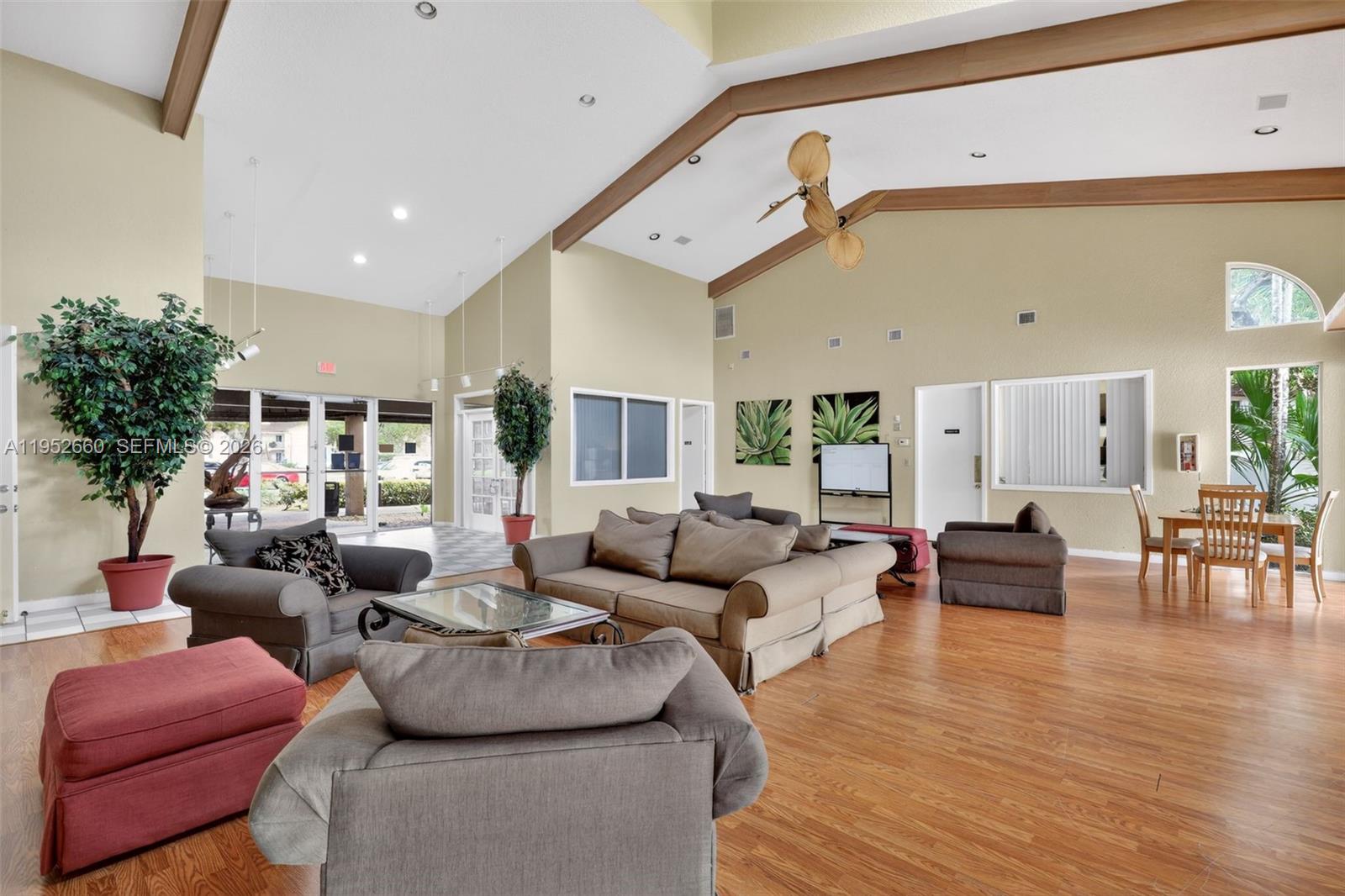 13856 Southwest 93rd Lane, Unit 13856 Miami, FL 33186 - Photo 35 of 37 a living room with furniture and a large window