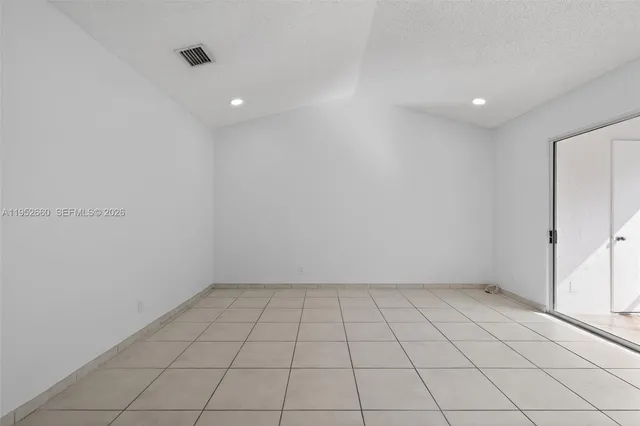 a view of an empty room and window