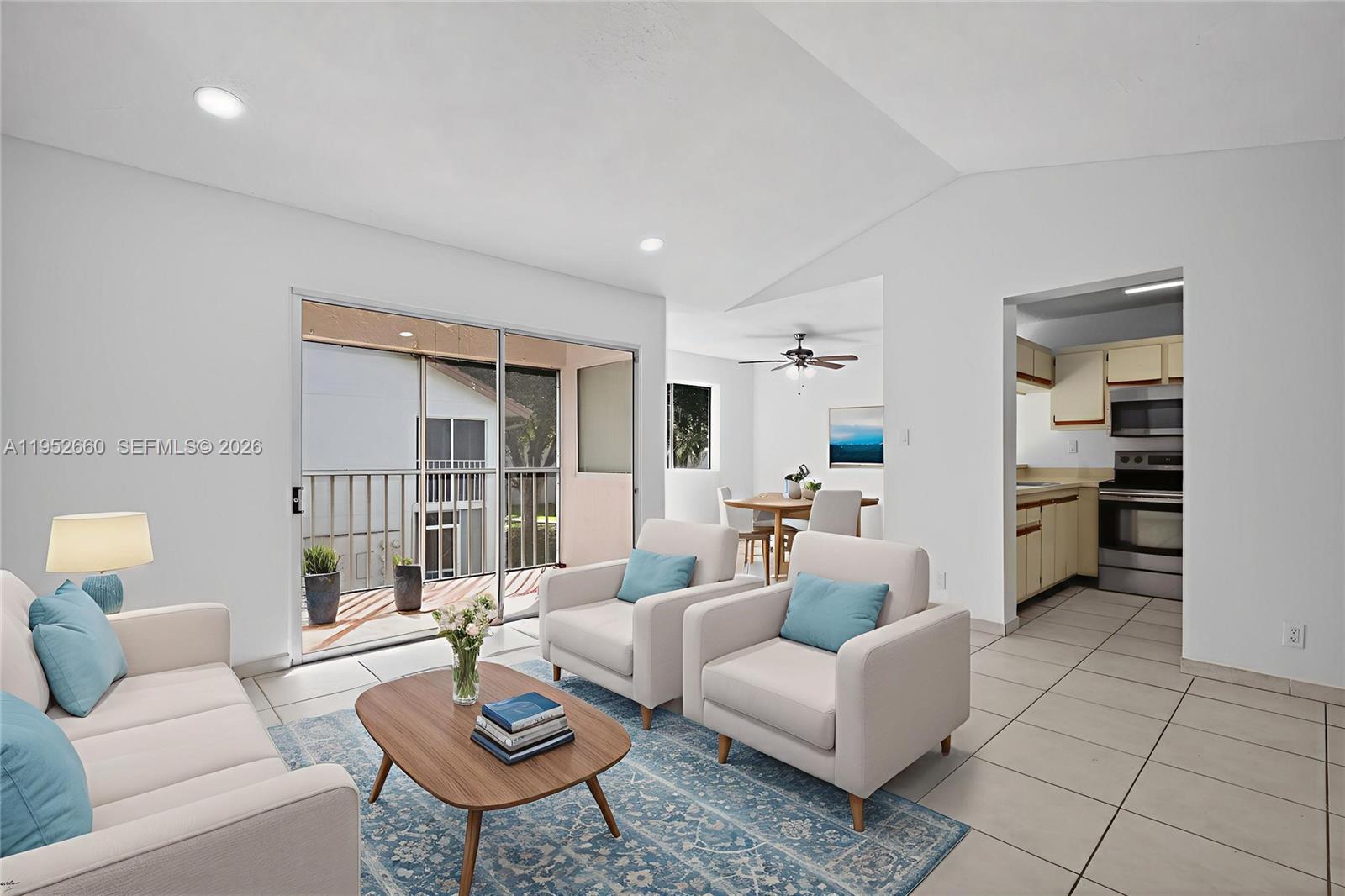 13856 Southwest 93rd Lane, Unit 13856 Miami, FL 33186 - Photo 10 of 37 a living room with furniture and a table