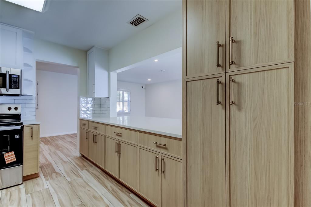3936 East Eden Roc Circle Tampa, FL 33634 - Photo 21 of 68 a bathroom with a double vanity sink and a mirror