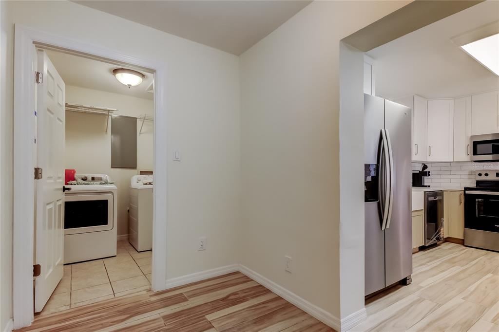 3936 East Eden Roc Circle Tampa, FL 33634 - Photo 23 of 68 a view of a kitchen from the hallway with a sink