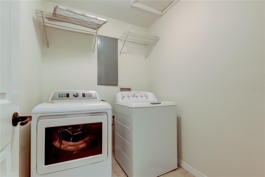 3936 East Eden Roc Circle Tampa, FL 33634 - Photo 24 of 68 a utility room with dryer and washer