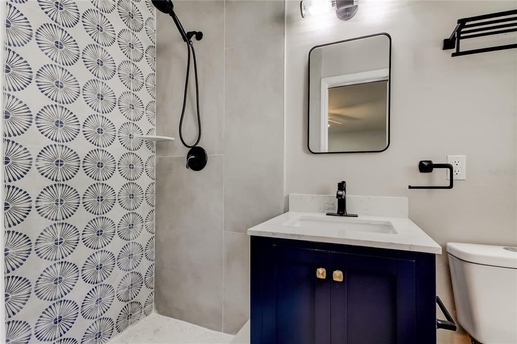 3936 East Eden Roc Circle Tampa, FL 33634 - Photo 36 of 68 a bathroom with a sink vanity and toilet