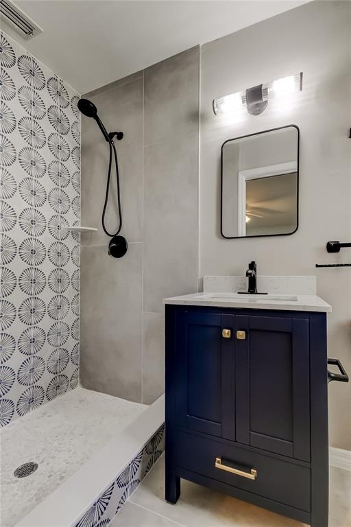 3936 East Eden Roc Circle Tampa, FL 33634 - Photo 37 of 68 a bathroom with a sink vanity and a mirror