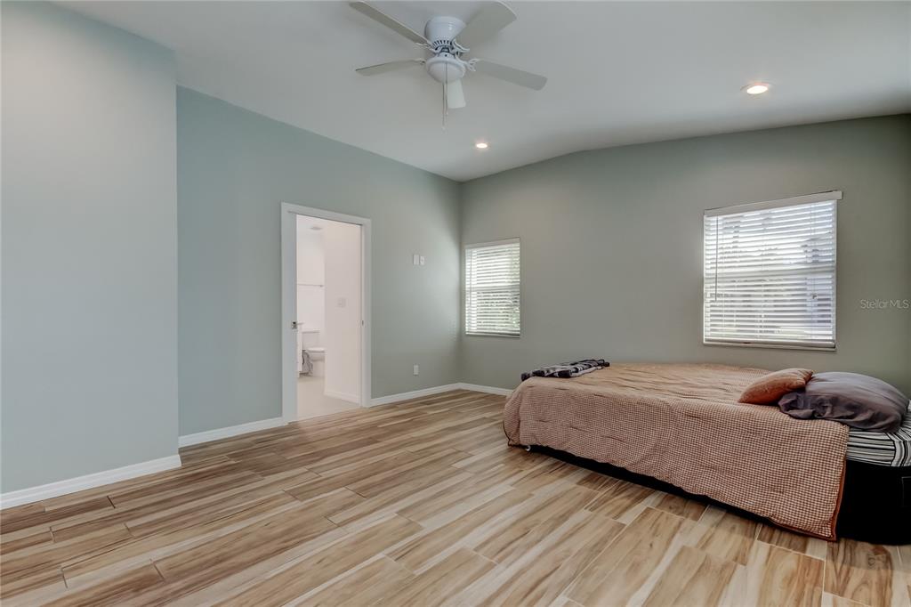 3936 East Eden Roc Circle Tampa, FL 33634 - Photo 47 of 68 a bedroom with a bed and window