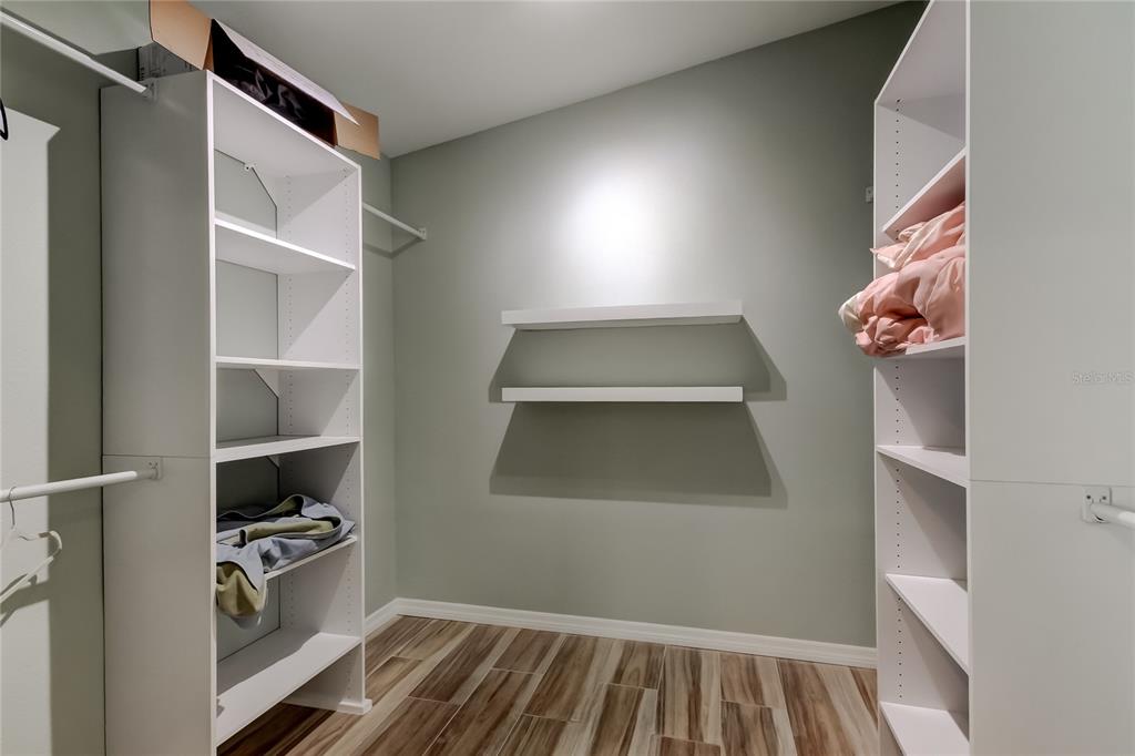 3936 East Eden Roc Circle Tampa, FL 33634 - Photo 49 of 68 a kitchen with white cabinets and a stove