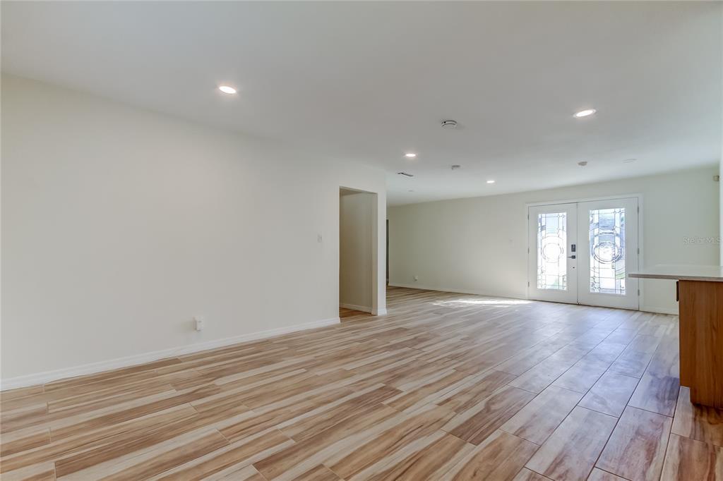 3936 East Eden Roc Circle Tampa, FL 33634 - Photo 5 of 68 a view of empty room with wooden floor