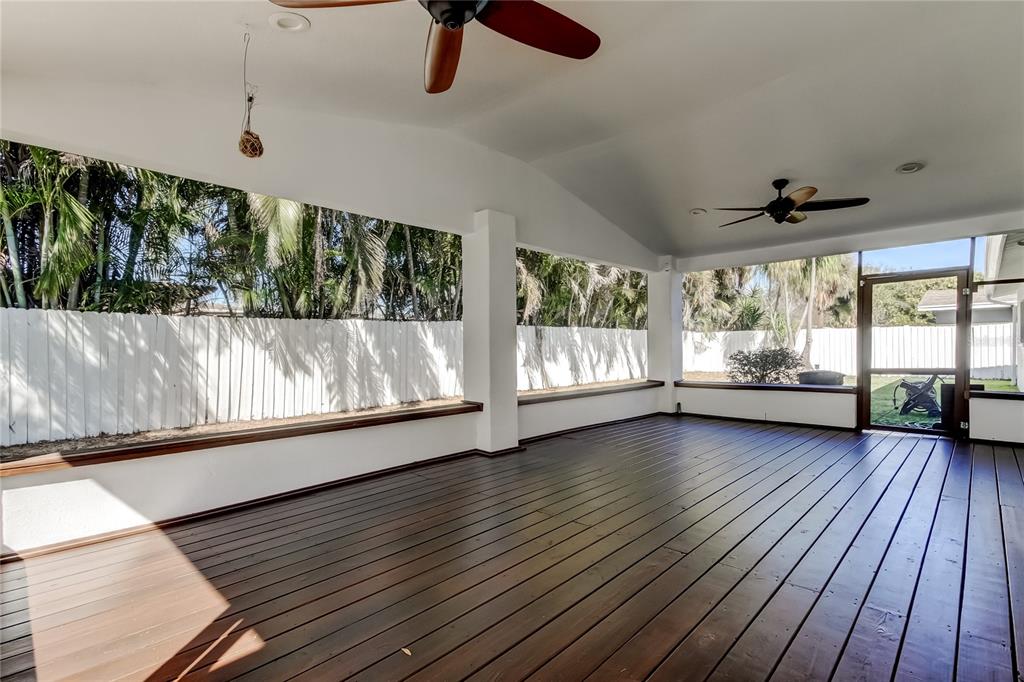 3936 East Eden Roc Circle Tampa, FL 33634 - Photo 56 of 68 wooden floor in an empty room with a window