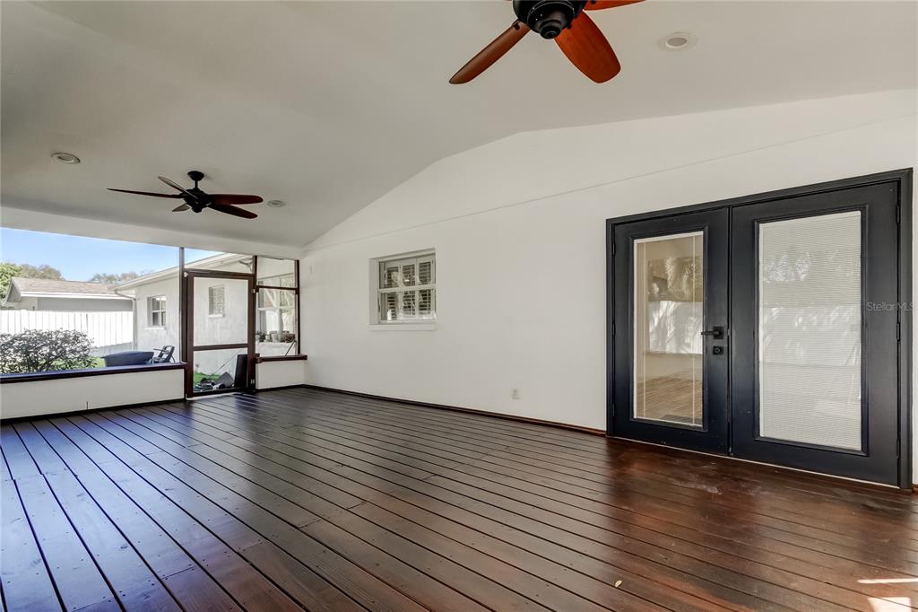 3936 East Eden Roc Circle Tampa, FL 33634 - Photo 57 of 68 a view of an empty room with wooden floor and a window
