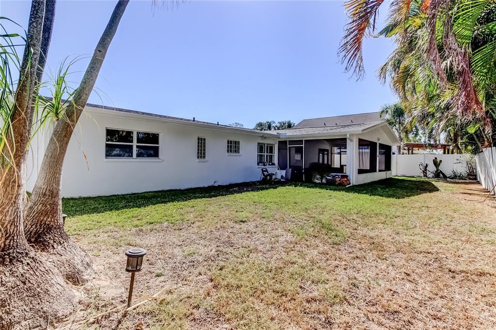 3936 East Eden Roc Circle Tampa, FL 33634 - Photo 62 of 68 a view of a house with backyard and sitting area