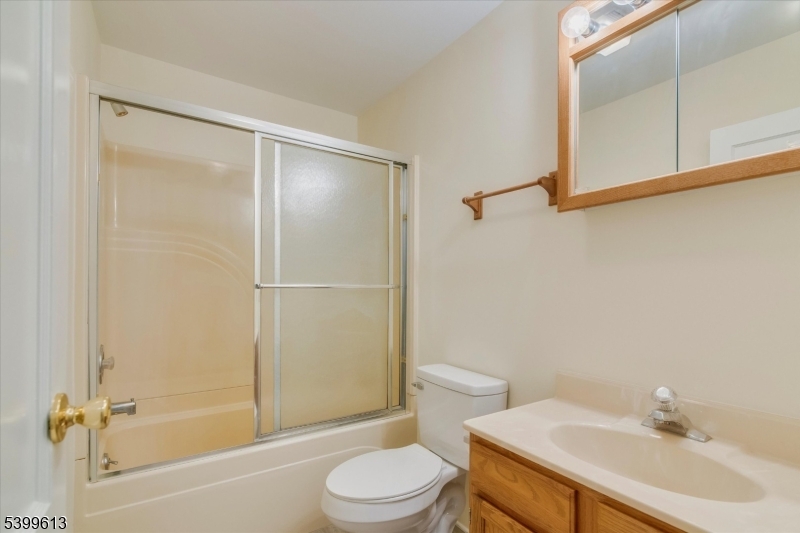 52 Hampton House Road Newton, NJ 07860 - Photo 15 of 22 a bathroom with a sink toilet and shower