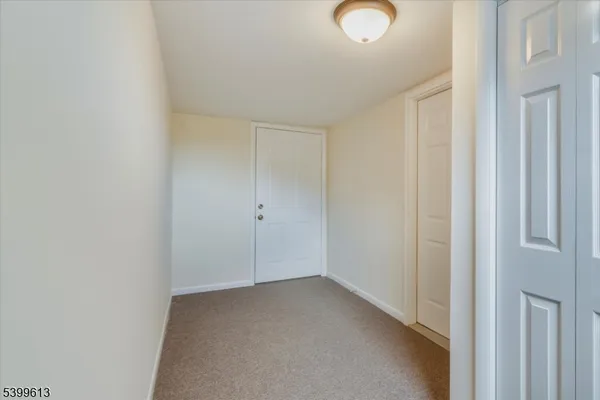 a view of a room with a hallway