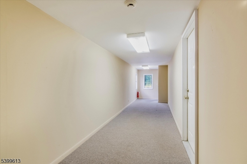 52 Hampton House Road Newton, NJ 07860 - Photo 20 of 22 a view of a hallway with wooden floor and a window