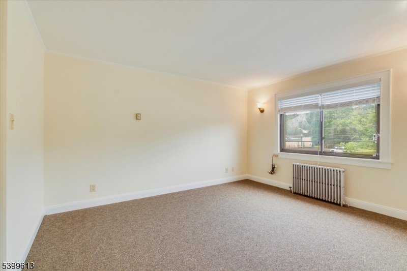 52 Hampton House Road Newton, NJ 07860 - Photo 6 of 22 an empty room with windows