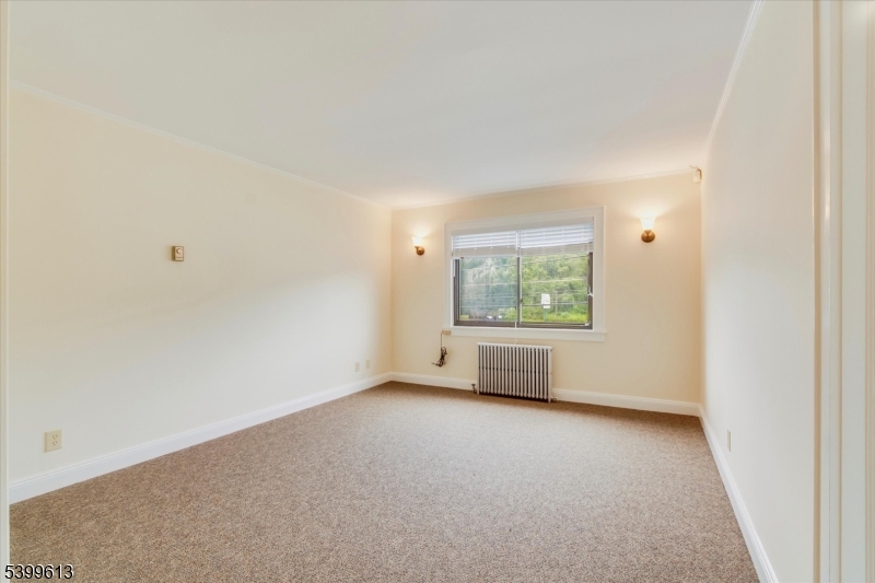 52 Hampton House Road Newton, NJ 07860 - Photo 7 of 22 an empty room with windows