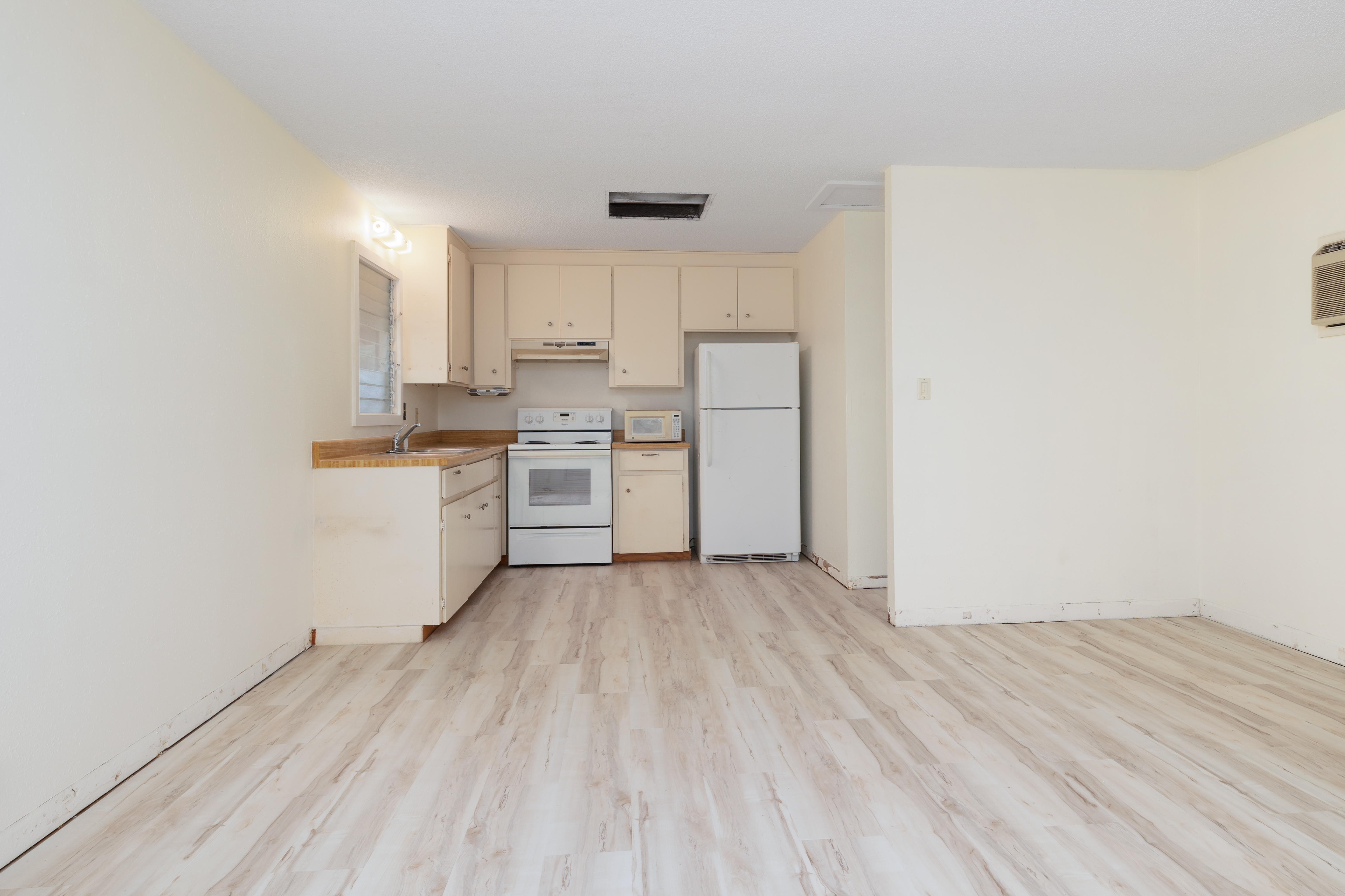 75-185-b Alakai Street, Unit B Kailua-Kona, HI 96740 - Photo 16 of 27 a view of kitchen with wooden floor