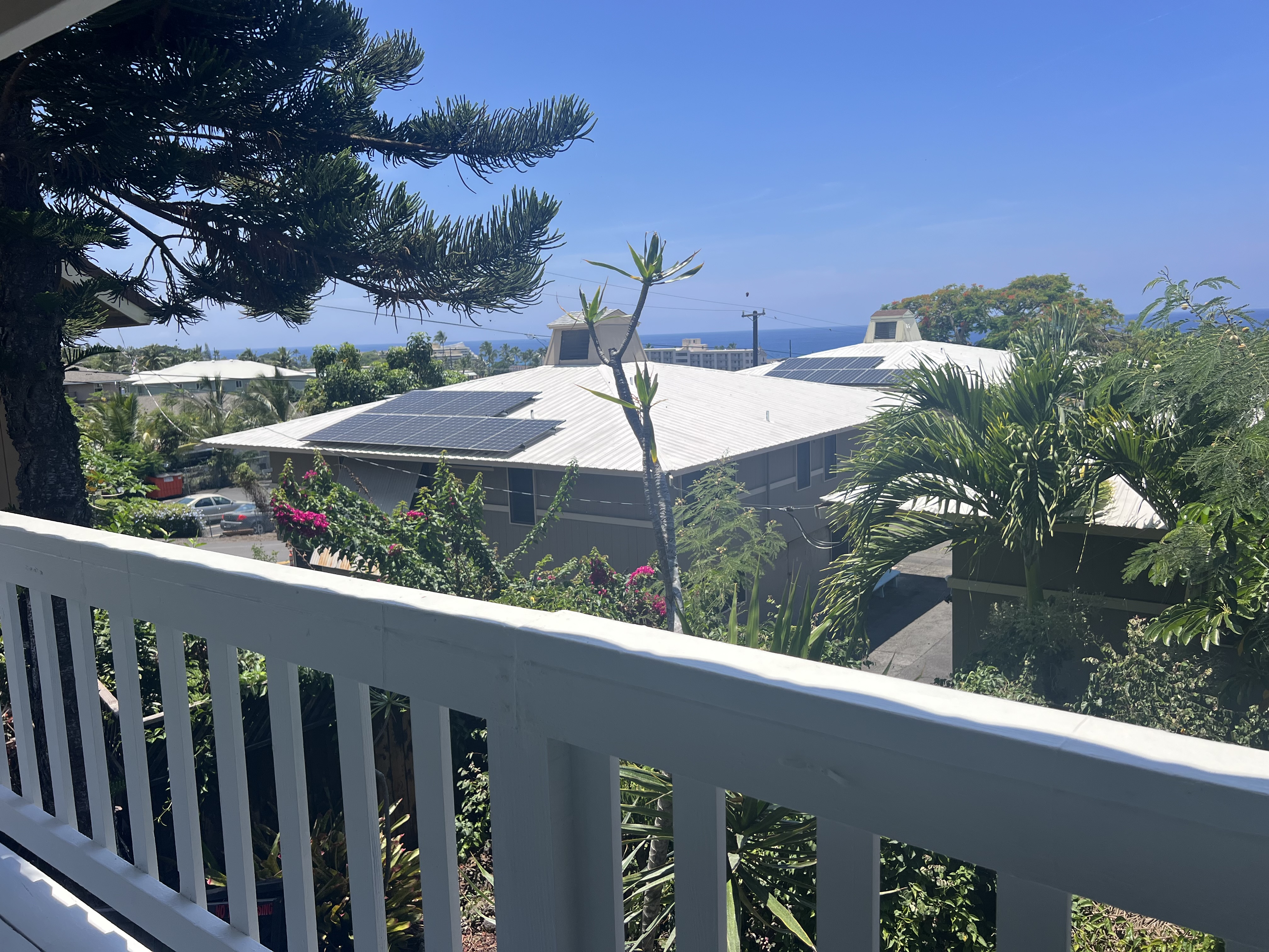 75-185-b Alakai Street, Unit B Kailua-Kona, HI 96740 - Photo 22 of 27 a roof deck with table and chairs