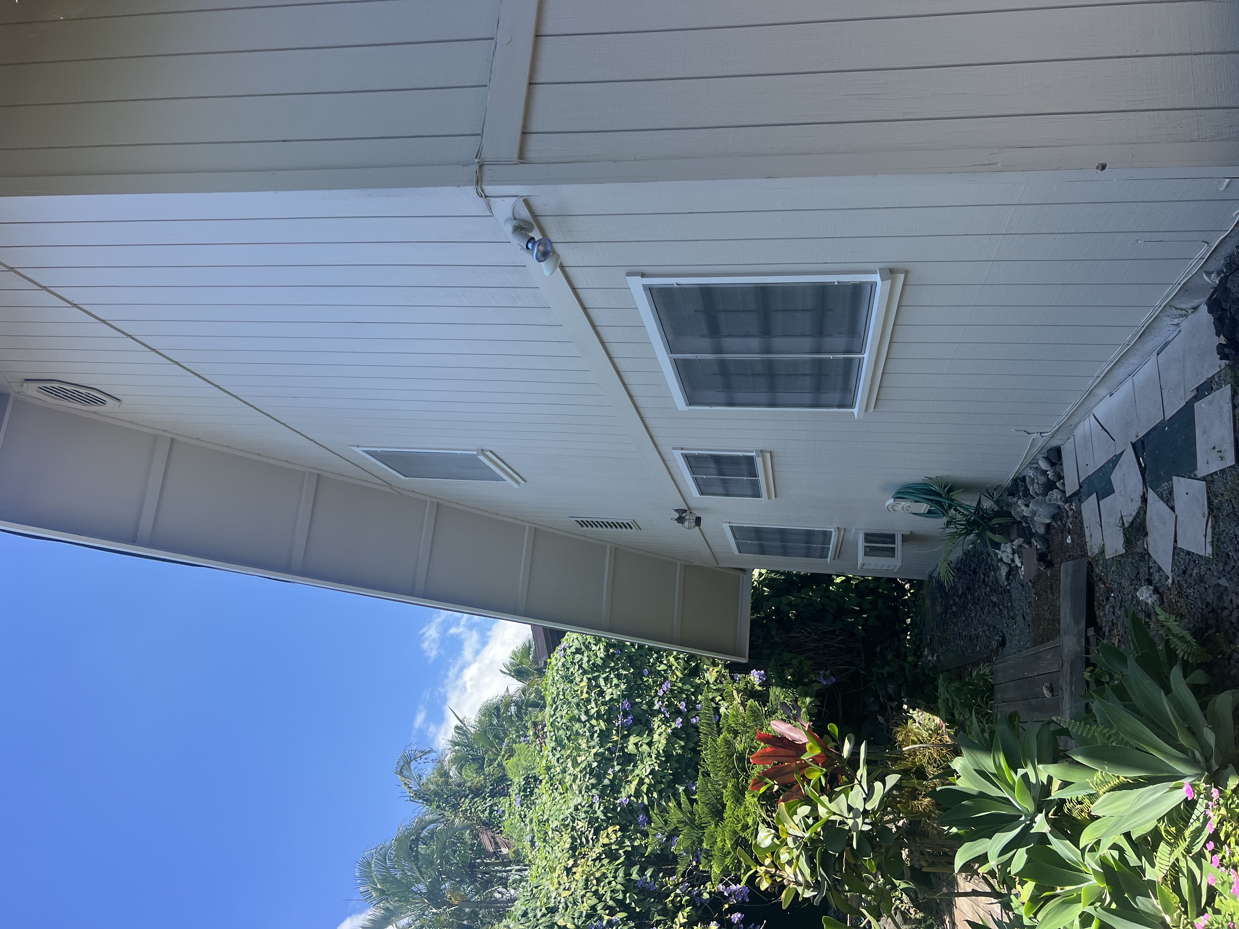 75-185-b Alakai Street, Unit B Kailua-Kona, HI 96740 - Photo 25 of 27 a backyard of a house with lots of green space