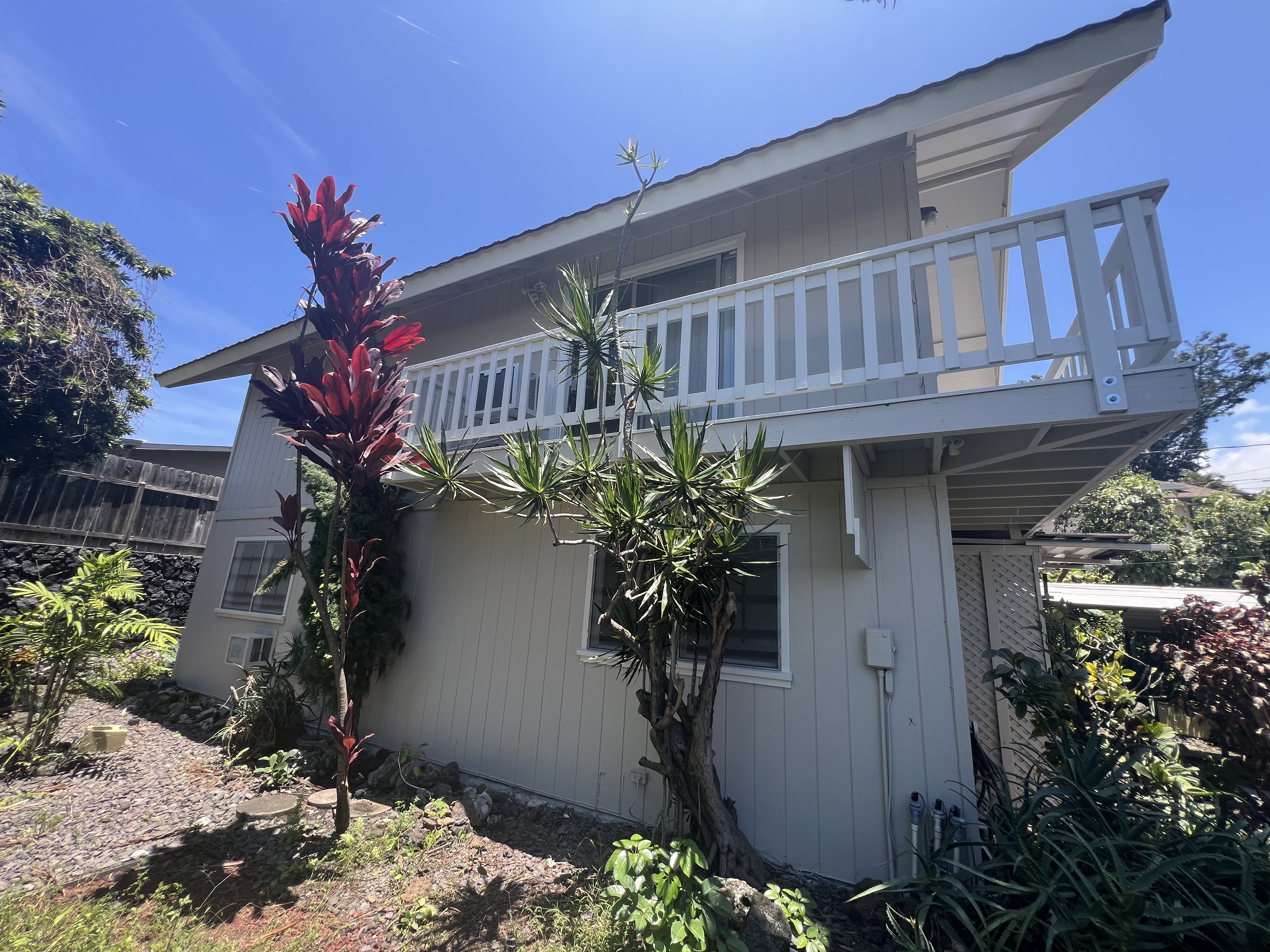 75-185-b Alakai Street, Unit B Kailua-Kona, HI 96740 - Photo 26 of 27 a flower plants in front of a house
