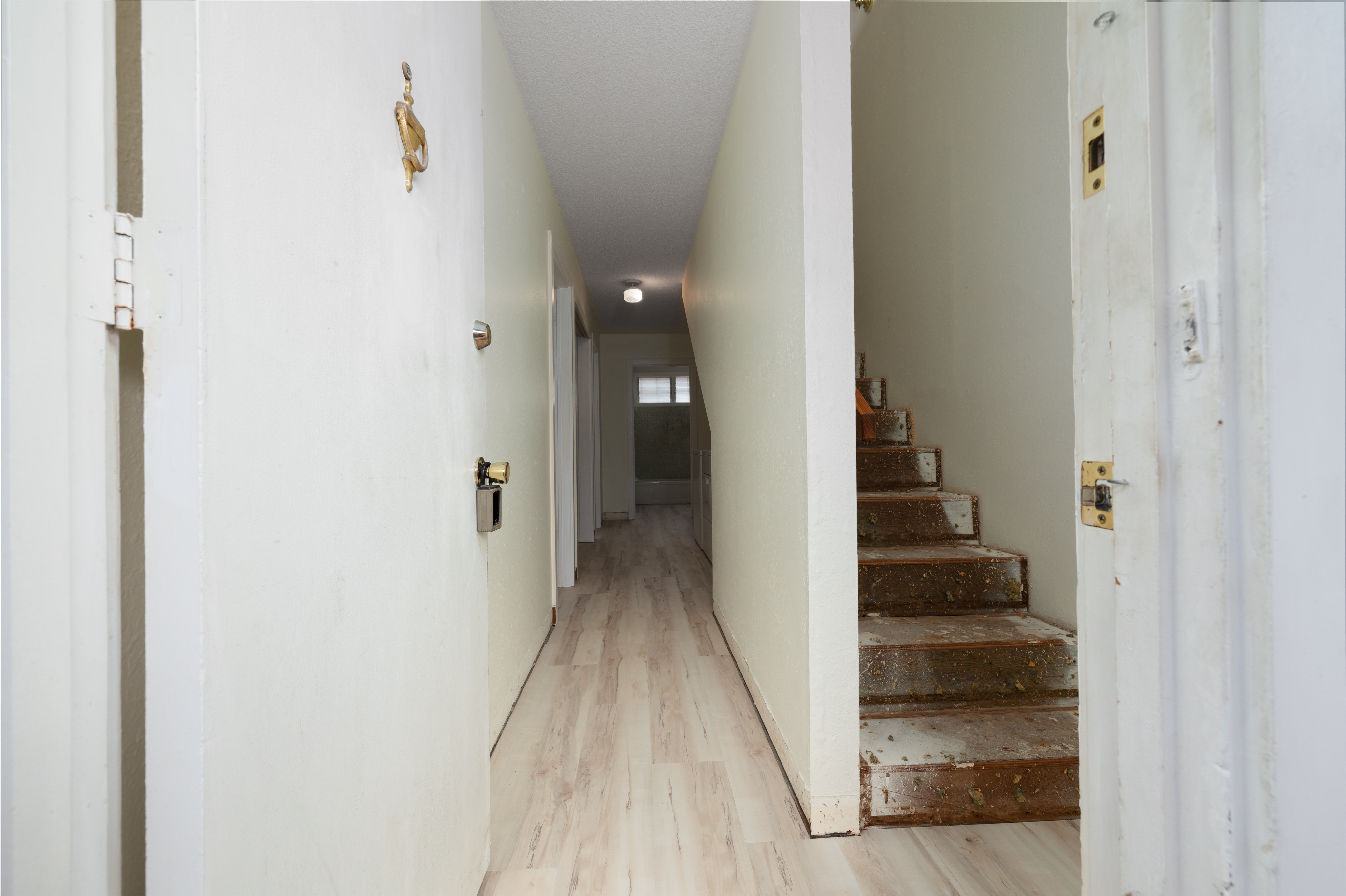 75-185-b Alakai Street, Unit B Kailua-Kona, HI 96740 - Photo 3 of 27 a view of a hallway with wooden floor and entryway