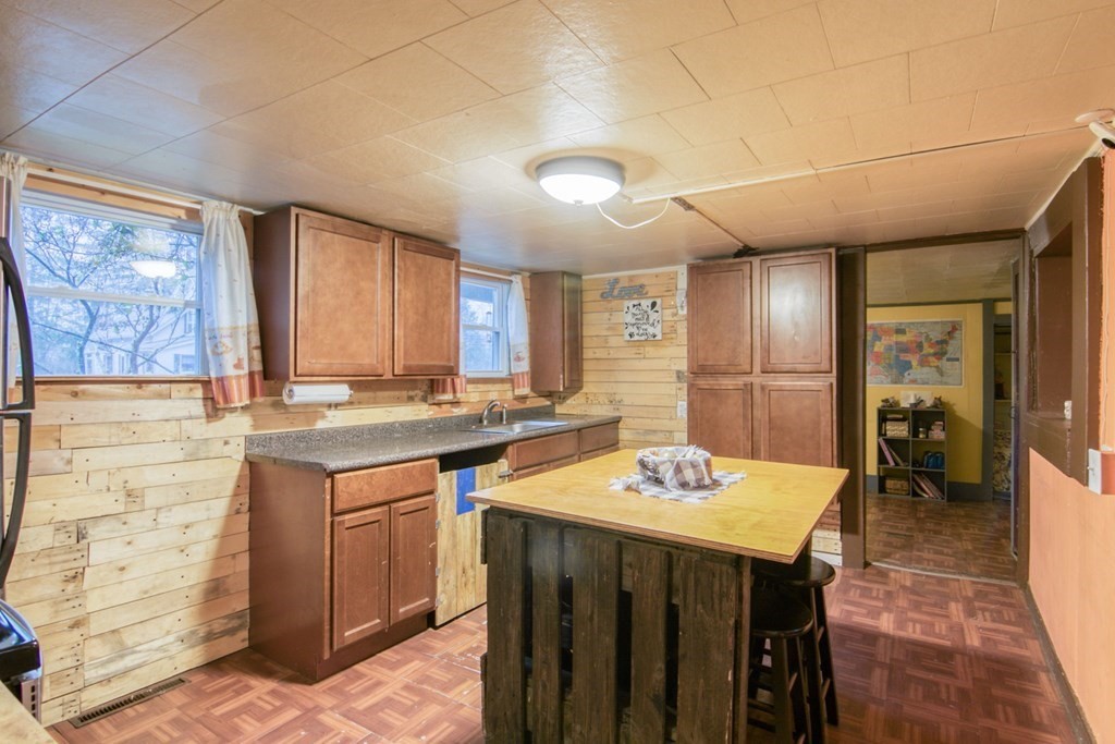 2 Three Rivers Road Wilbraham, MA 01095 - Photo 7 of 25 a kitchen with a sink and chairs