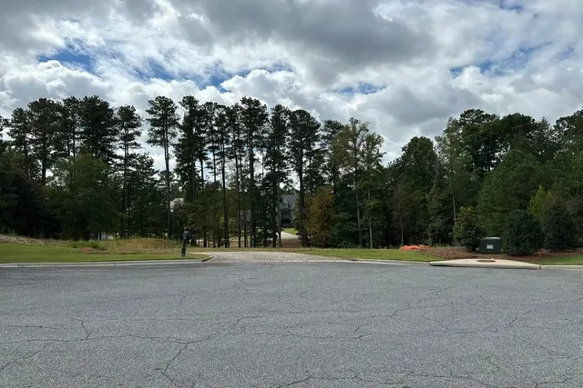 a view of a golf course with a lake