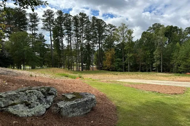 a view of a playground with basketball court