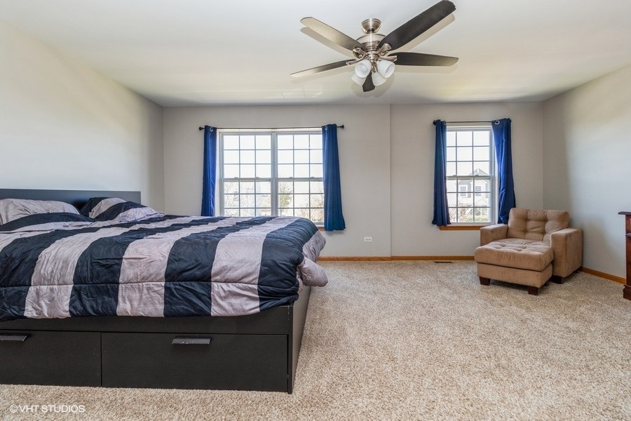 1504 Kempton Street Joliet, IL 60431 - Photo 7 of 15 a bedroom with a bed and window