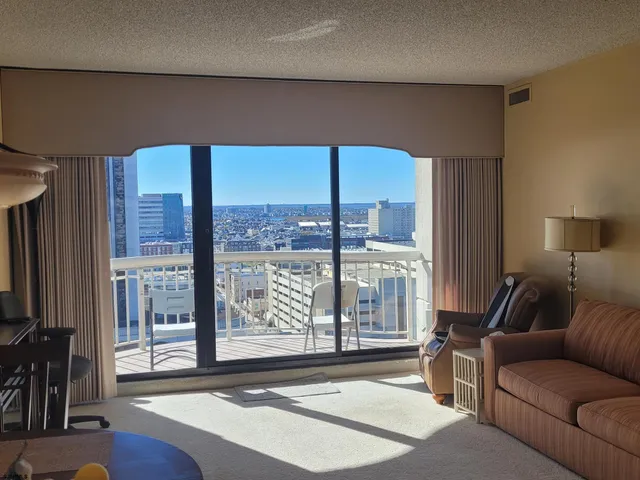 a view of a balcony with chairs