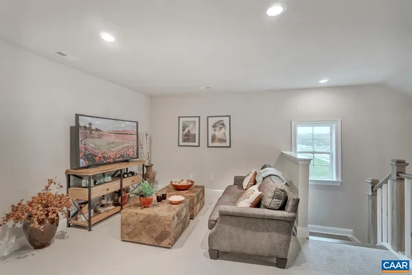 a living room with furniture and a couch