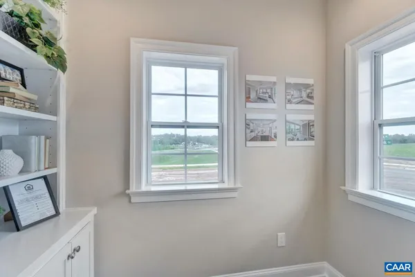 a room that has a window and a table in it
