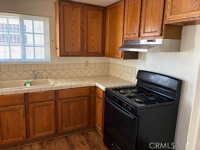 1612 South 7th Street, Unit B Alhambra, CA 91803 - Photo 2 of 6 a kitchen with granite countertop a sink stove and cabinets