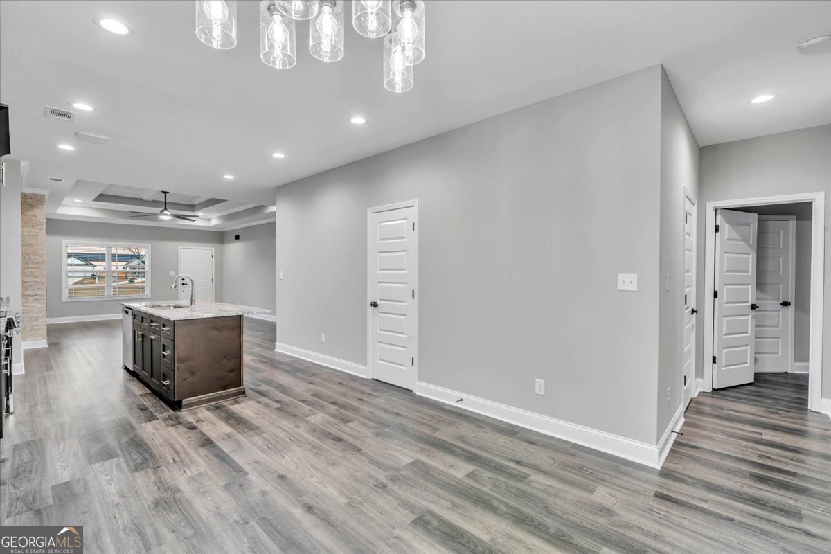 212 Eric Court Byron, GA 31008 - Photo 15 of 37 a view of kitchen with kitchen island stainless steel appliances refrigerator stove and wooden floor