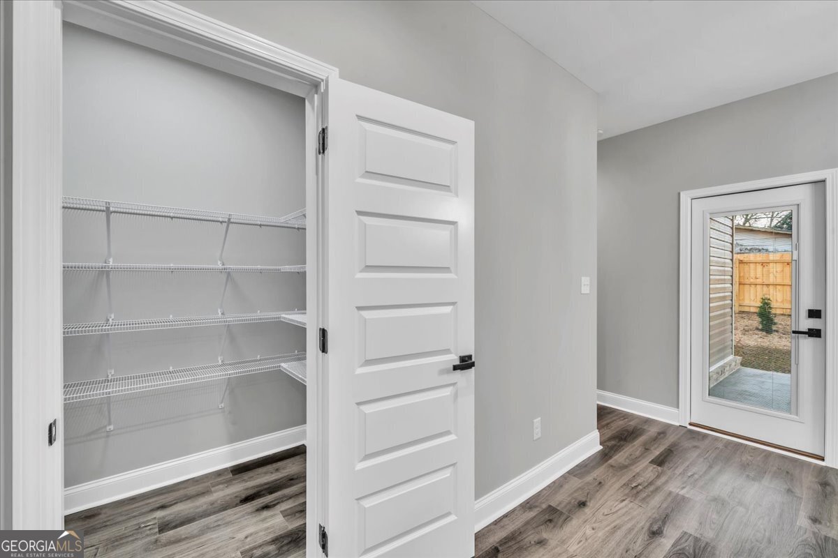 212 Eric Court Byron, GA 31008 - Photo 16 of 37 a view of walk in closet with empty racks