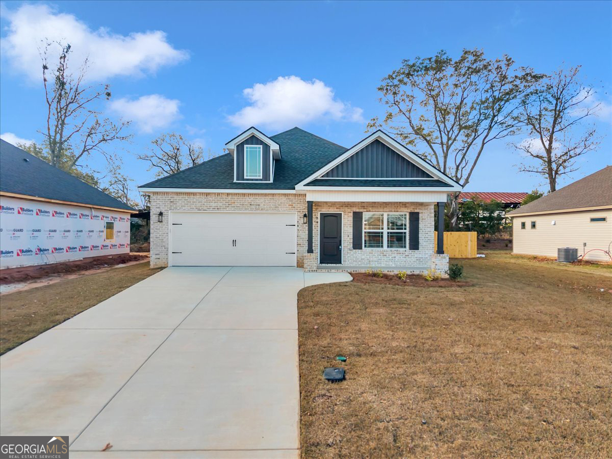 212 Eric Court Byron, GA 31008 - Photo 2 of 37 a front view of a house with a yard