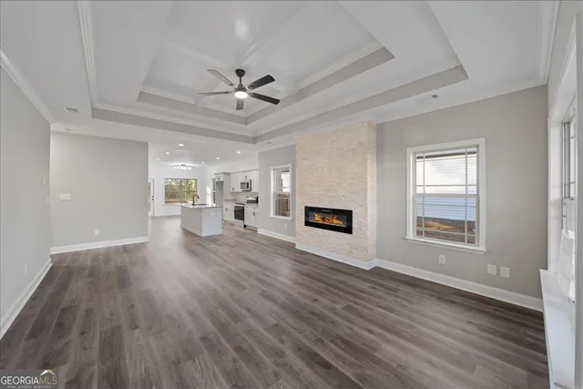 a view of livingroom with hardwood floor and a ceiling fan