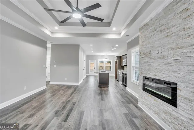 wooden floor in an empty room with a fireplace